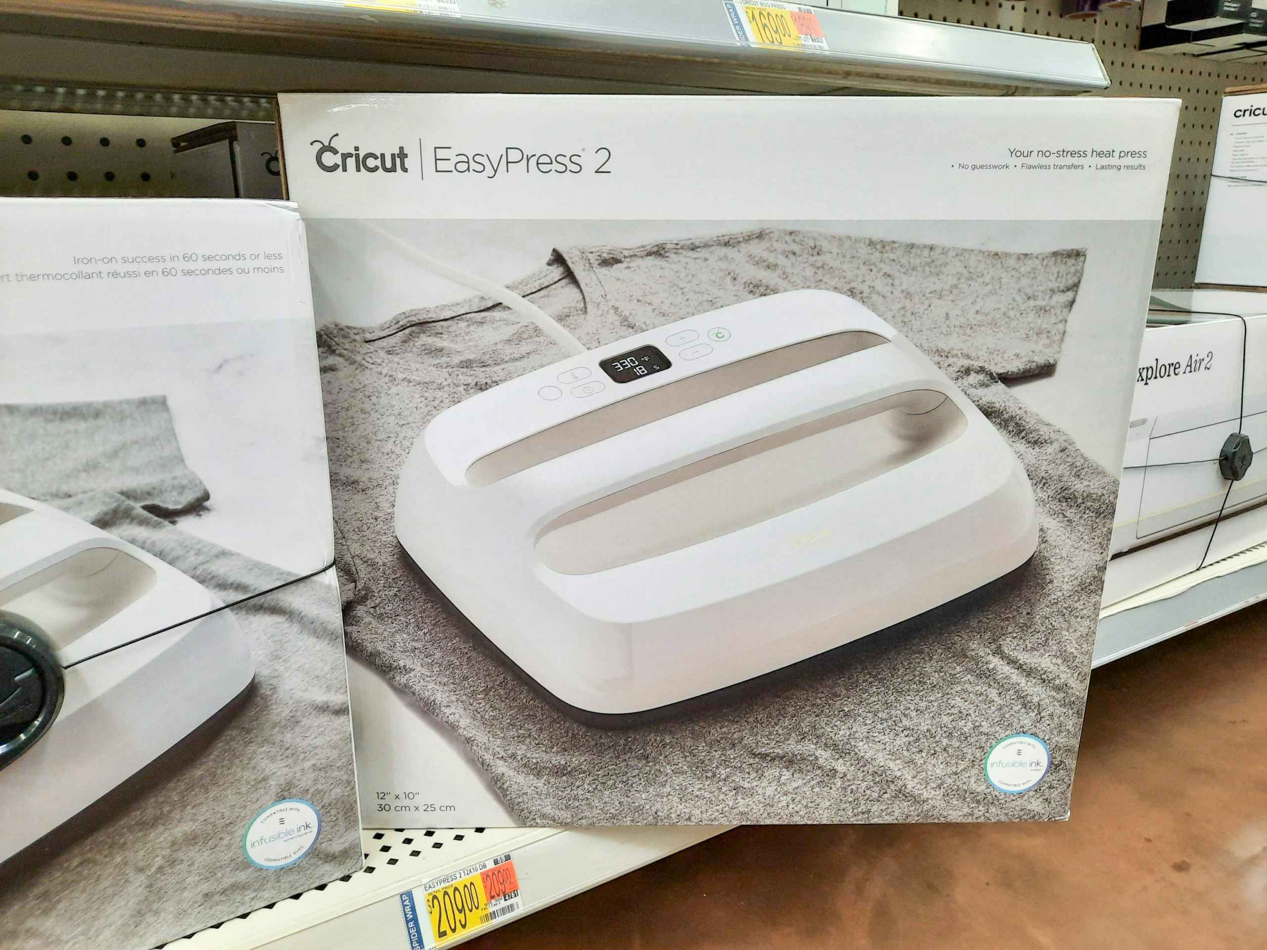 Cricut easypress 2 in box in a Walmart store shelf, turned diagonally towards the camera