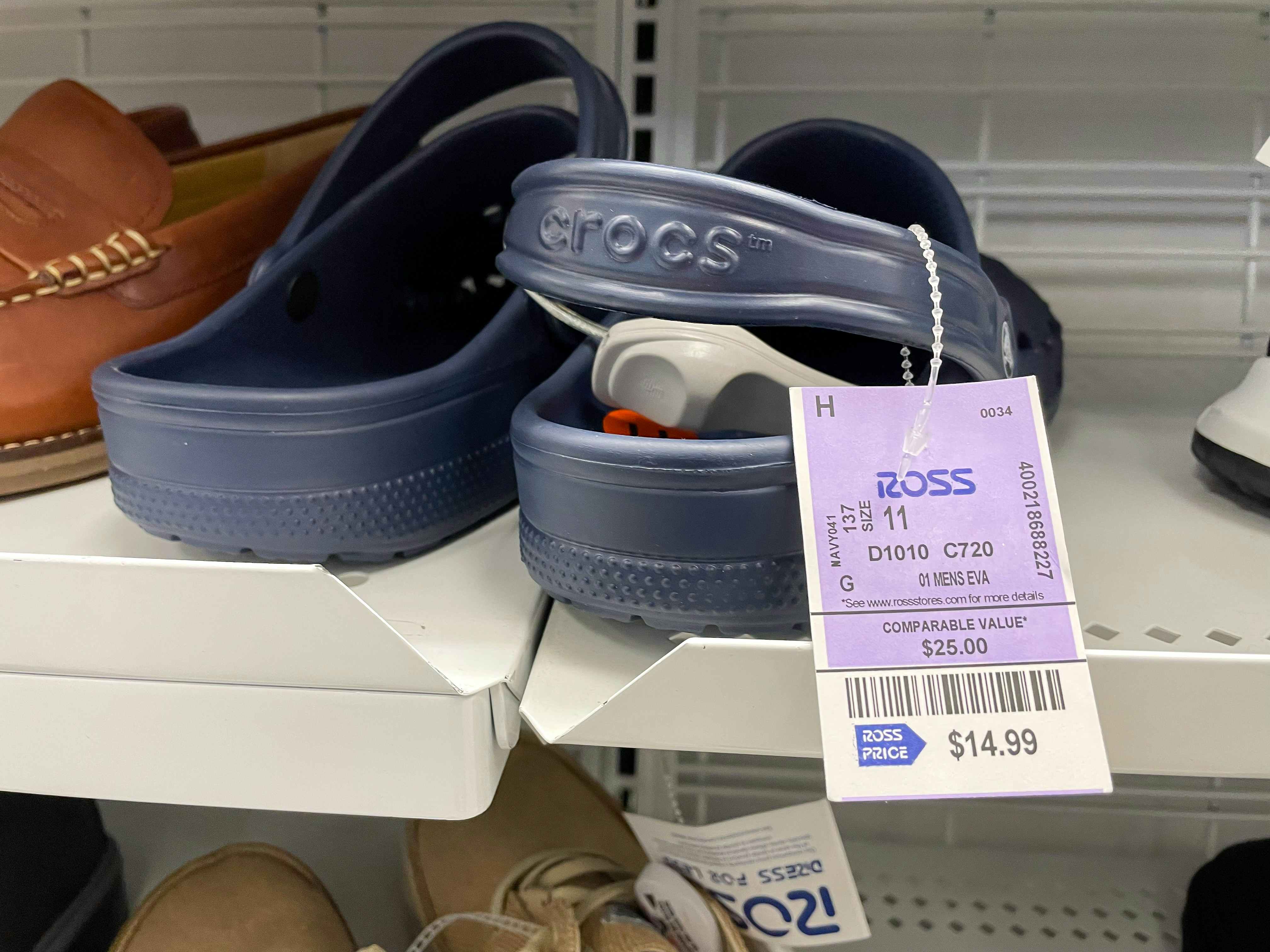 A pair of Crocs sitting on a shelf at Ross.