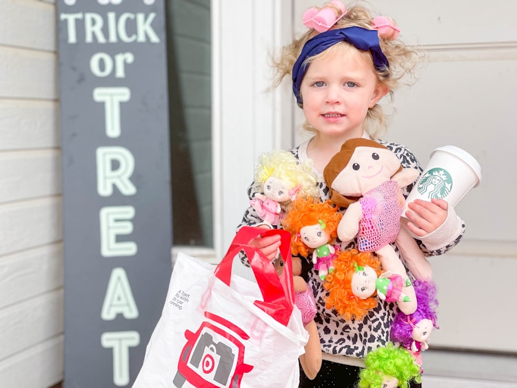 kid in hot mess mama costume in front of door 