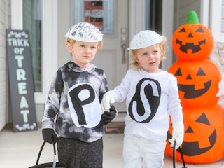 kids in salt and pepper costumes in front of door