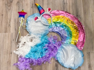 unicorn rainbow costume pieces piled together