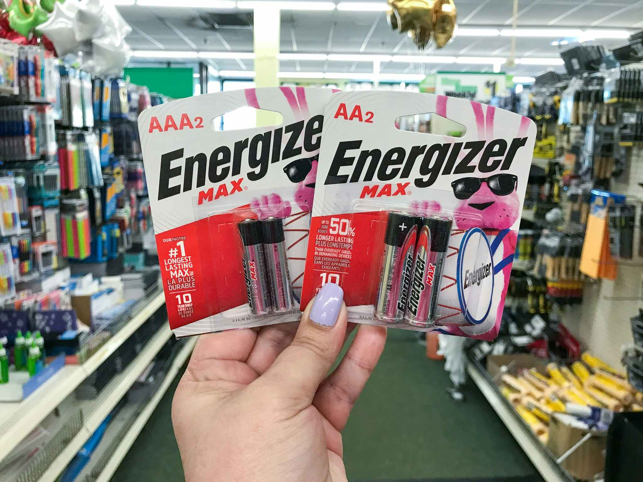 hand holding energizer max batteries at dollar tree