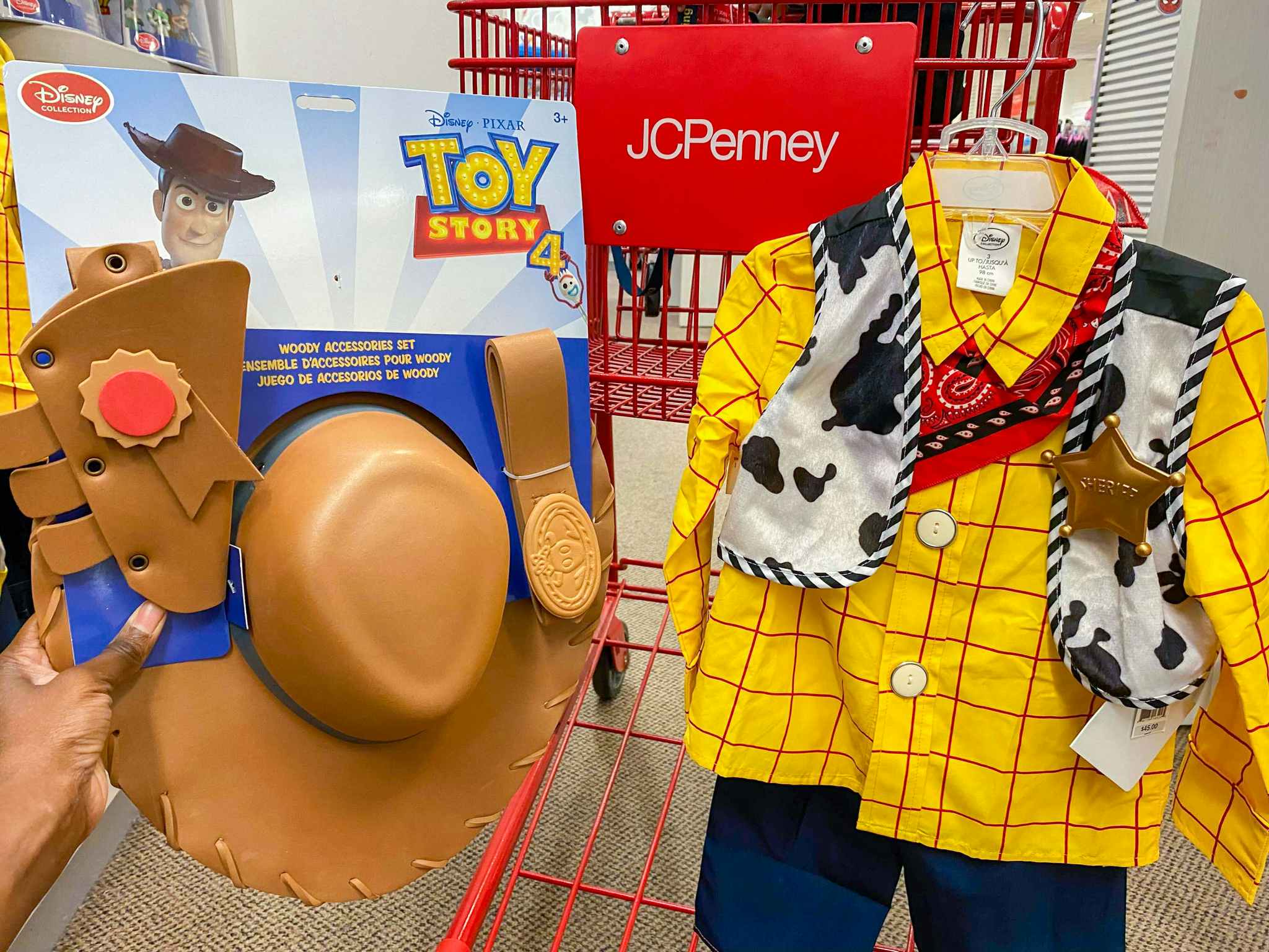 hand holding toy story woody costume