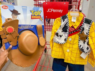 hand holding toy story woody costume