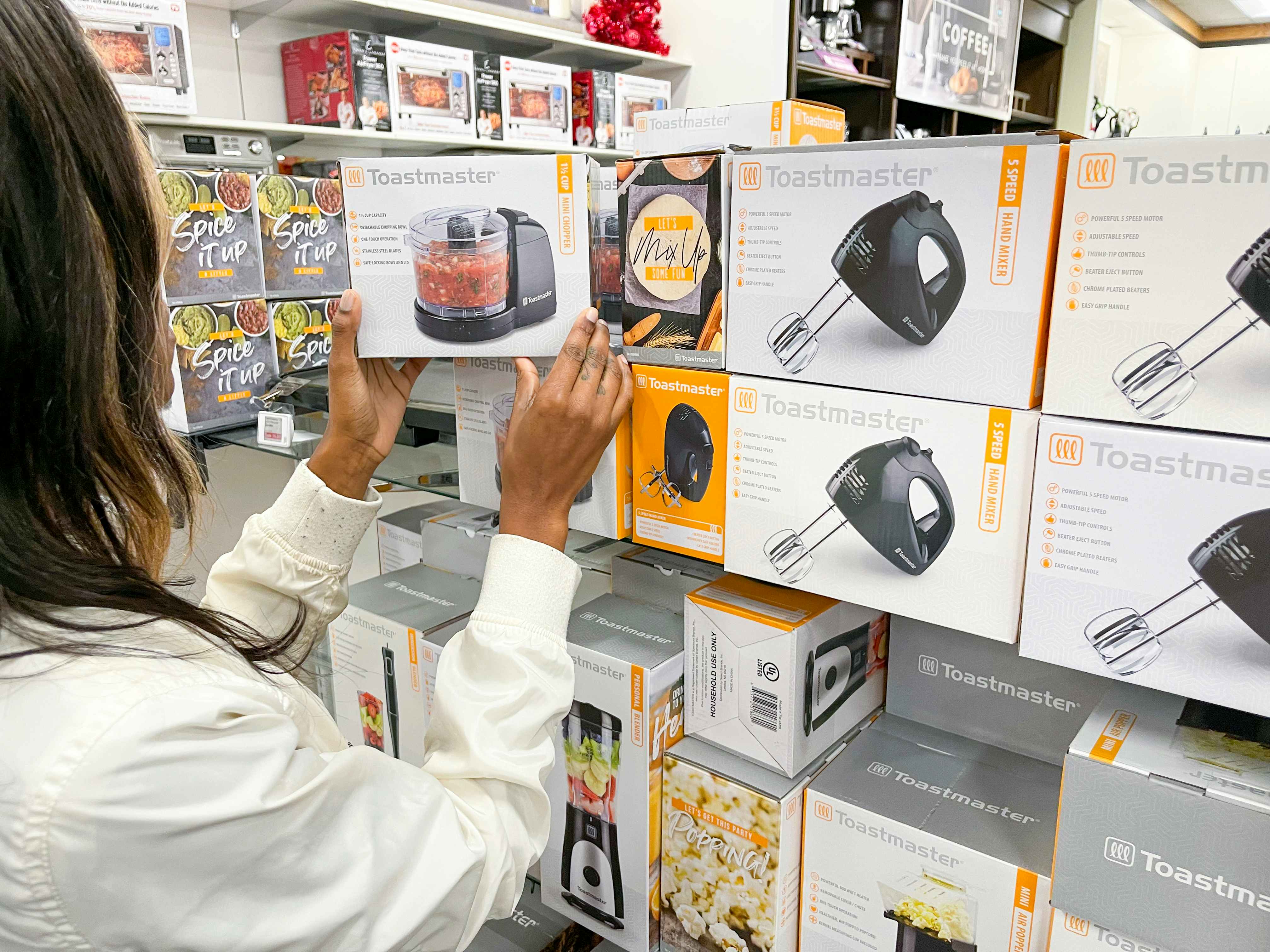 A woman looking at Toastmaster small appliances at Kohls.