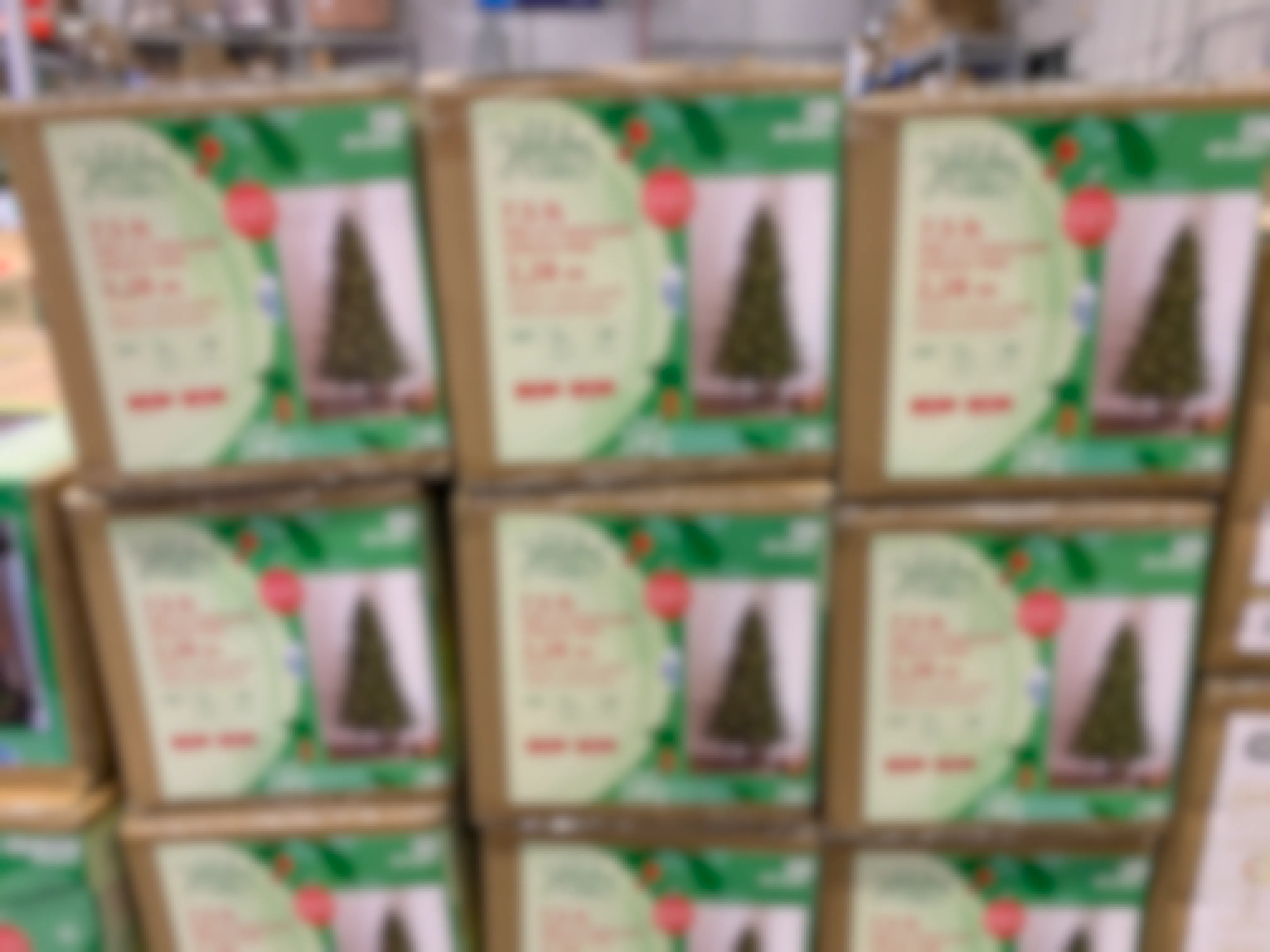 Holiday Living artificial Christmas tree boxes stacked at Lowe's during their Black Friday event.