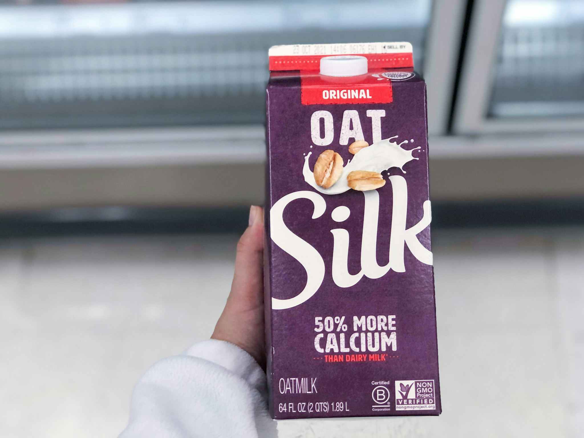 hand holding silk oatmilk at target