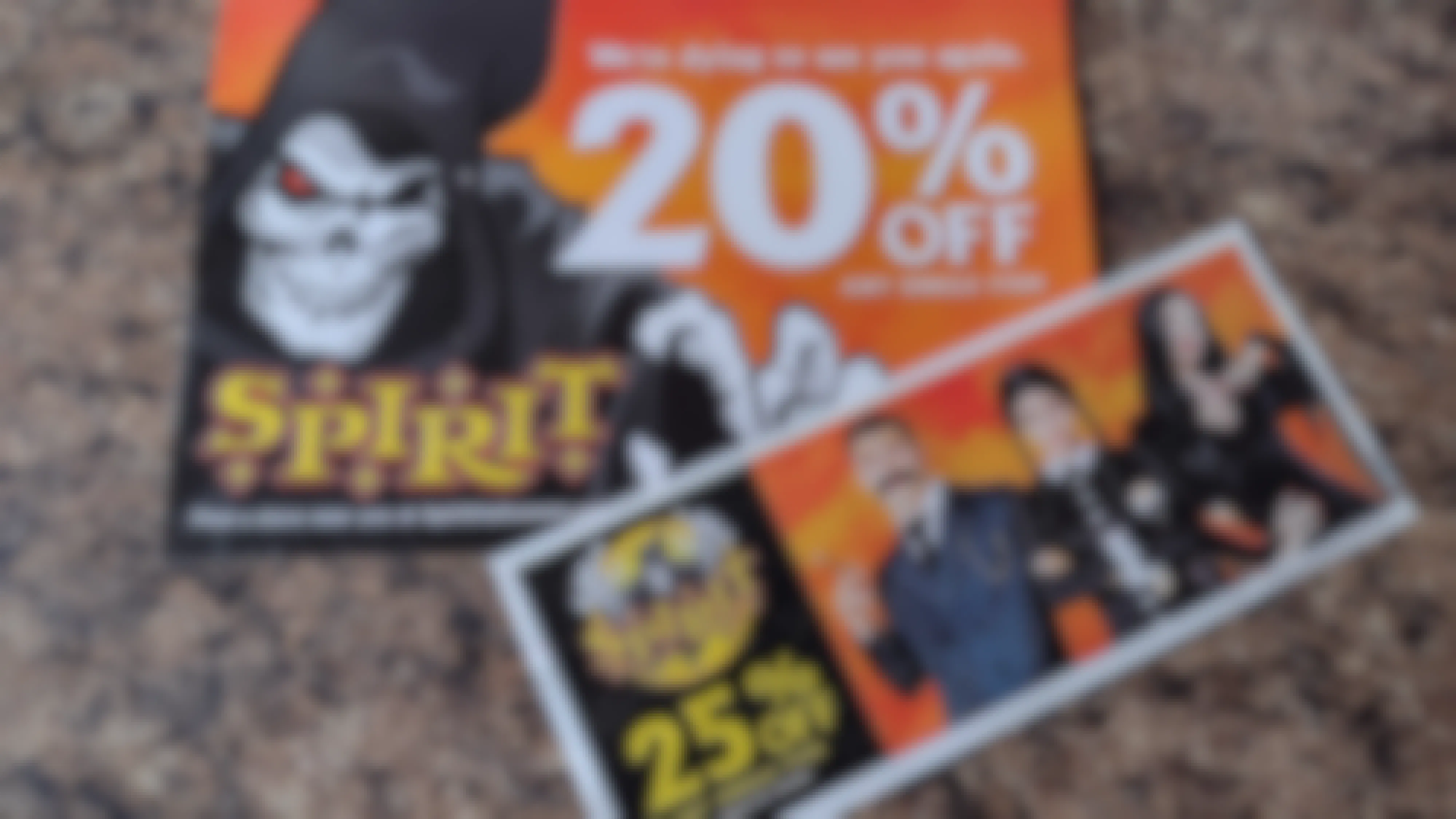 two spirit halloween paper coupons on counter top 2021