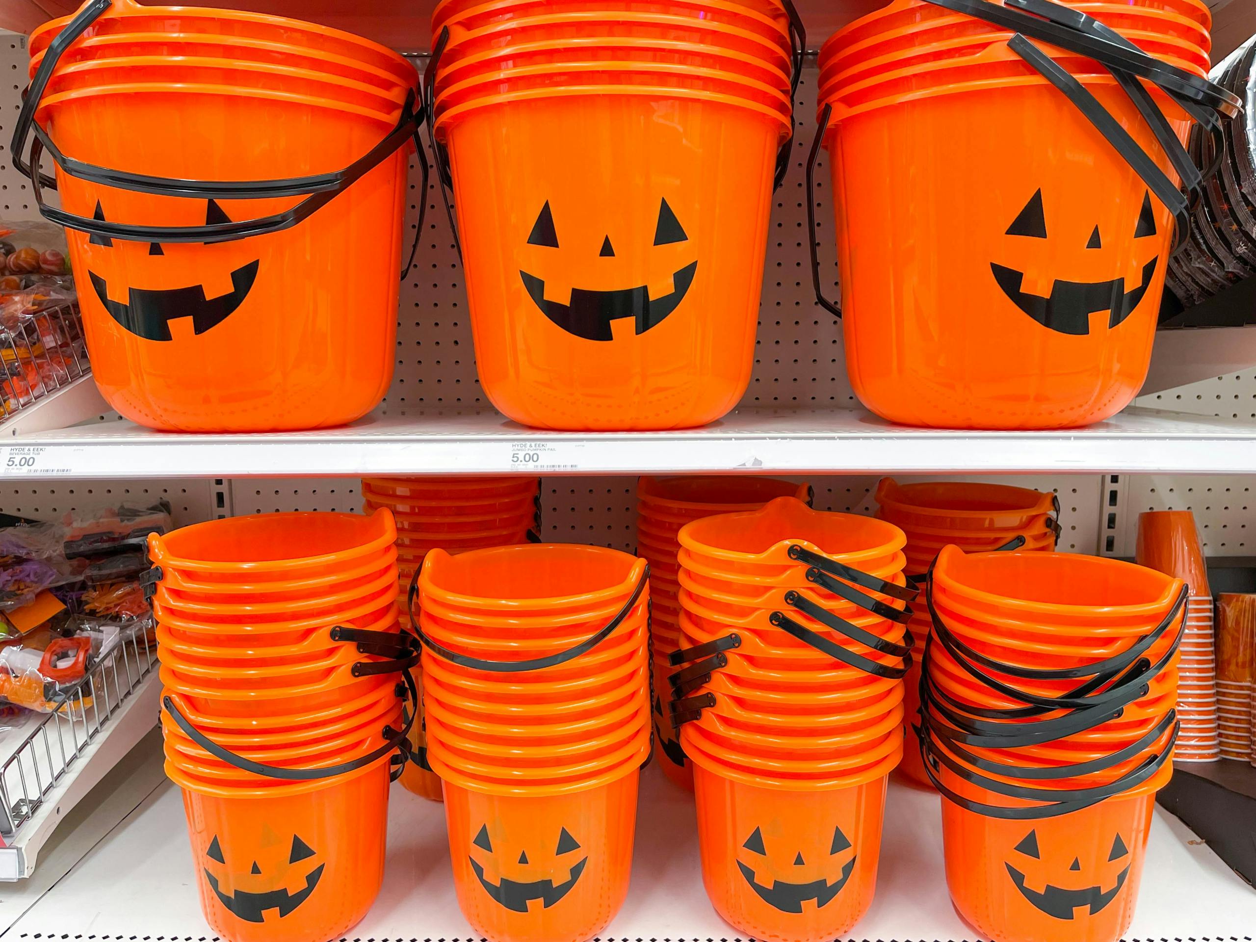 Hyde & EeK Boutique Pumpkin Stackable Halloween Trick-or-Treat Pails on a shelf at Target.