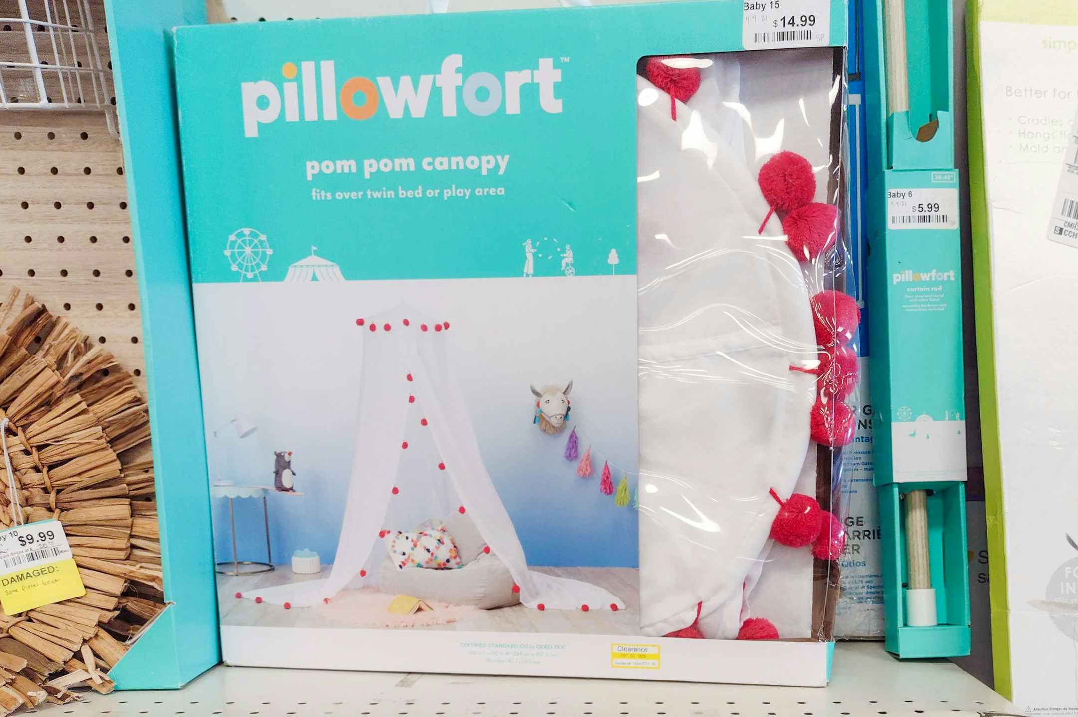 A Pillowfort pom pom canopy box sitting on a shelf.