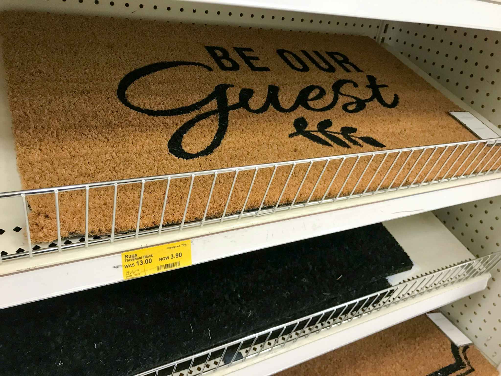threshold "be our guest" doormat on a target shelf