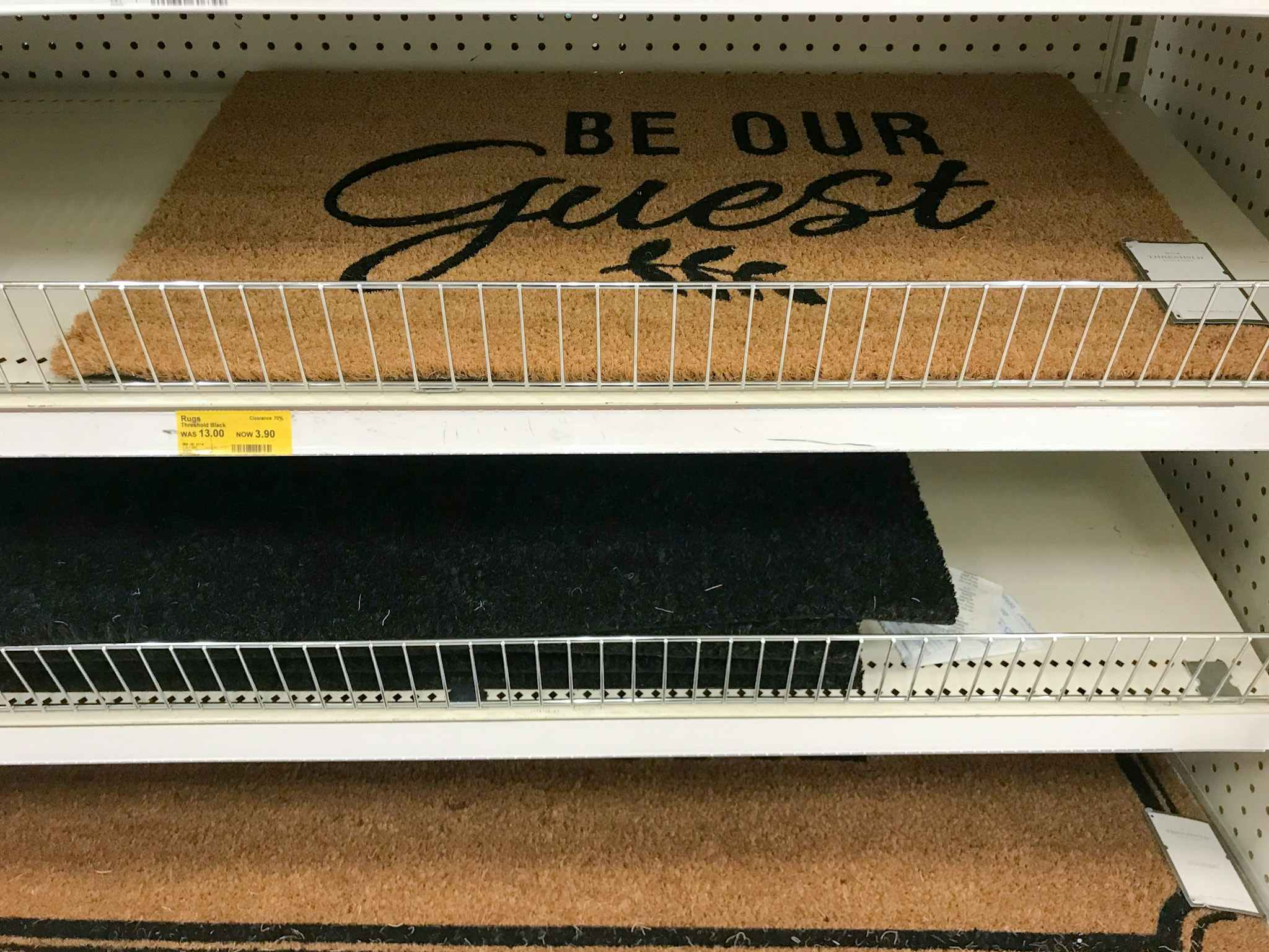 threshold "be our guest" doormat on a target shelf