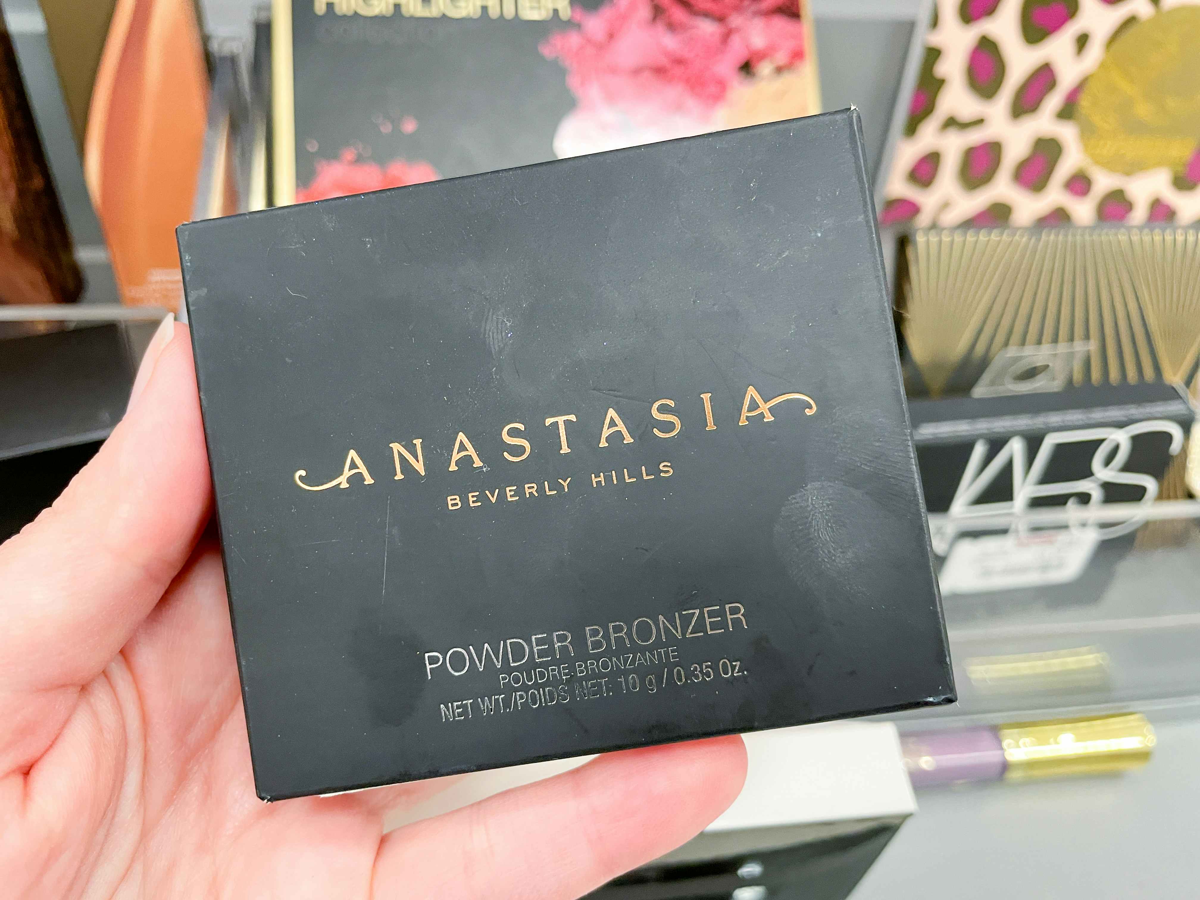 someone holding Anastasia bronzer at tjmaxx