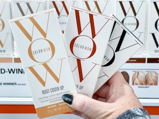 color wow root cover up boxes being held