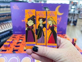 hand holding lip cremes