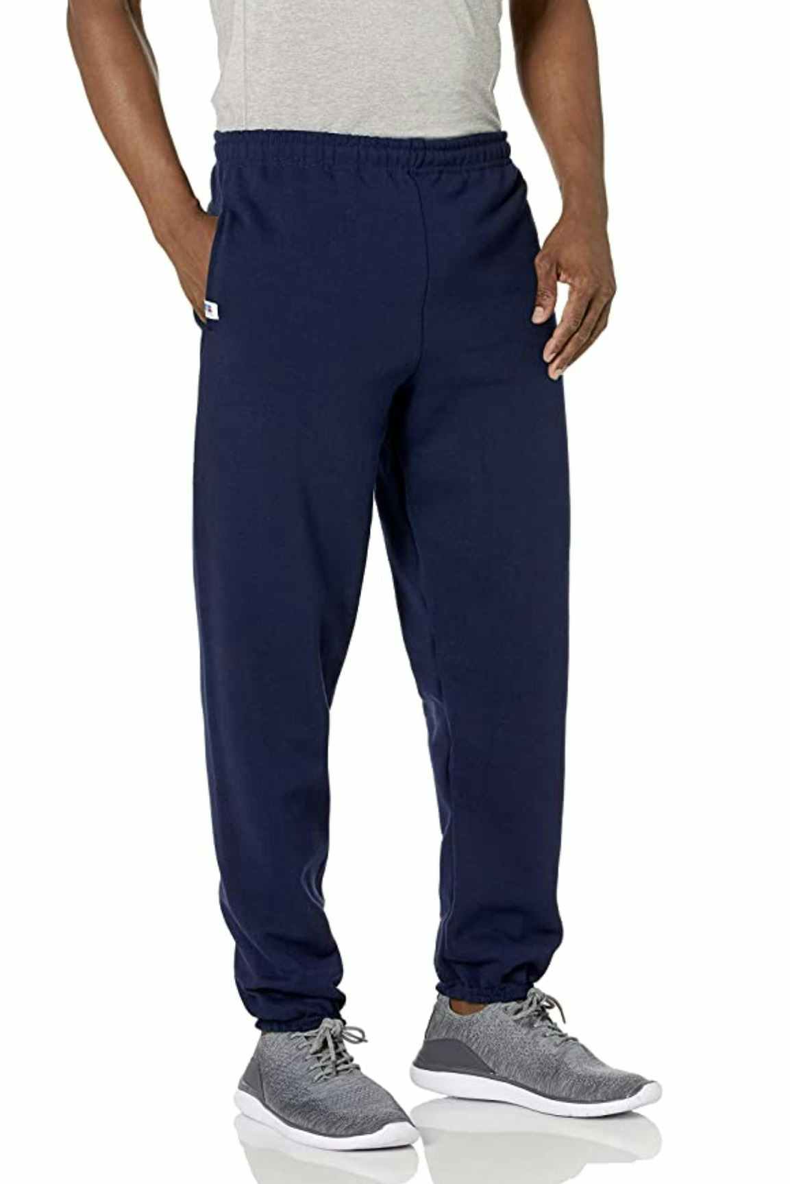 A man wearing blue Russell Athletic sweatpants.