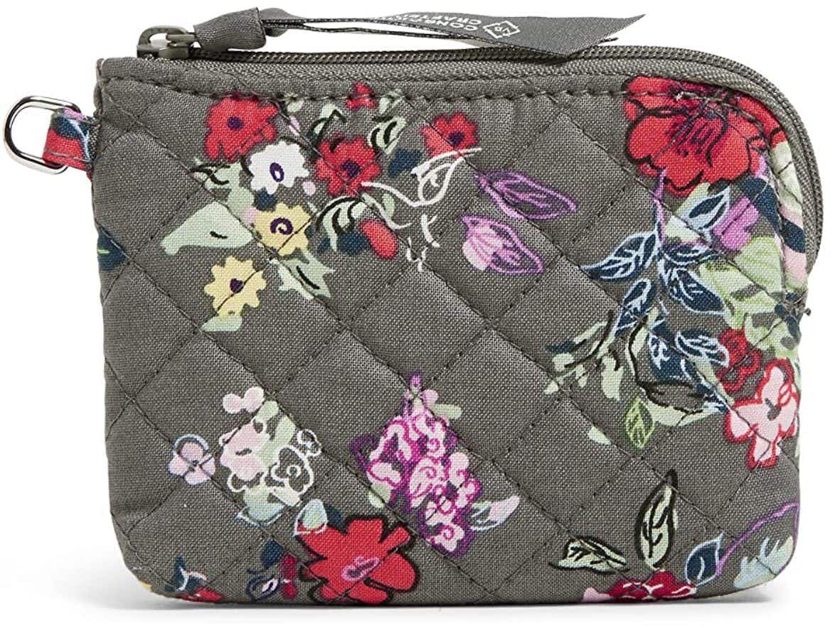 A Very Bradley coin purse with flowers on it.