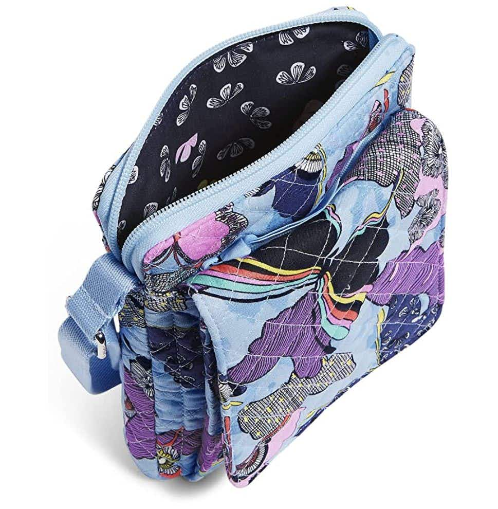 A Vera Bradley crossbody purse with a butterfly design.