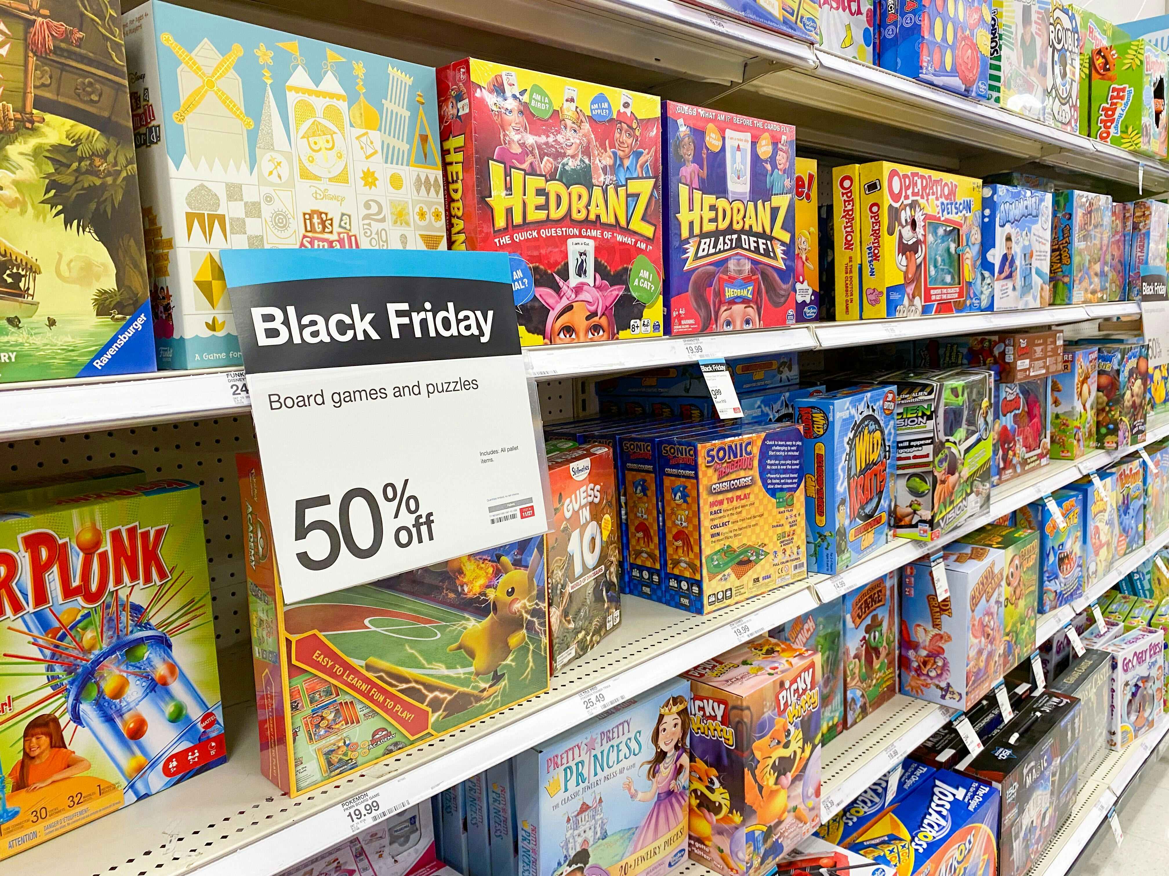 a whole aisle of board games with a sign that says 50% off for Black Friday at Target