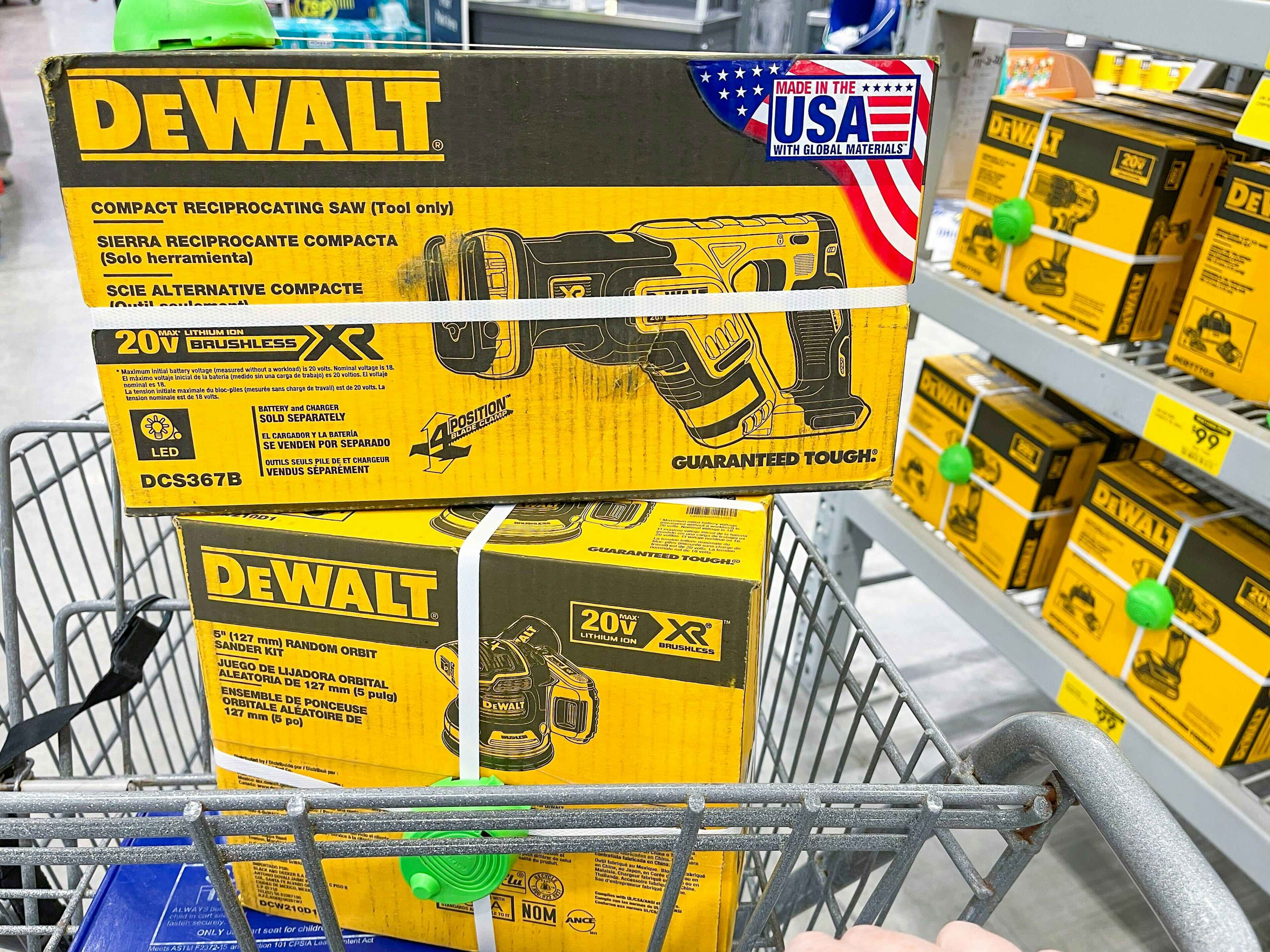 Dewalt power tools in their boxes, sitting in the basket of a shopping cart at Lowe's black friday..