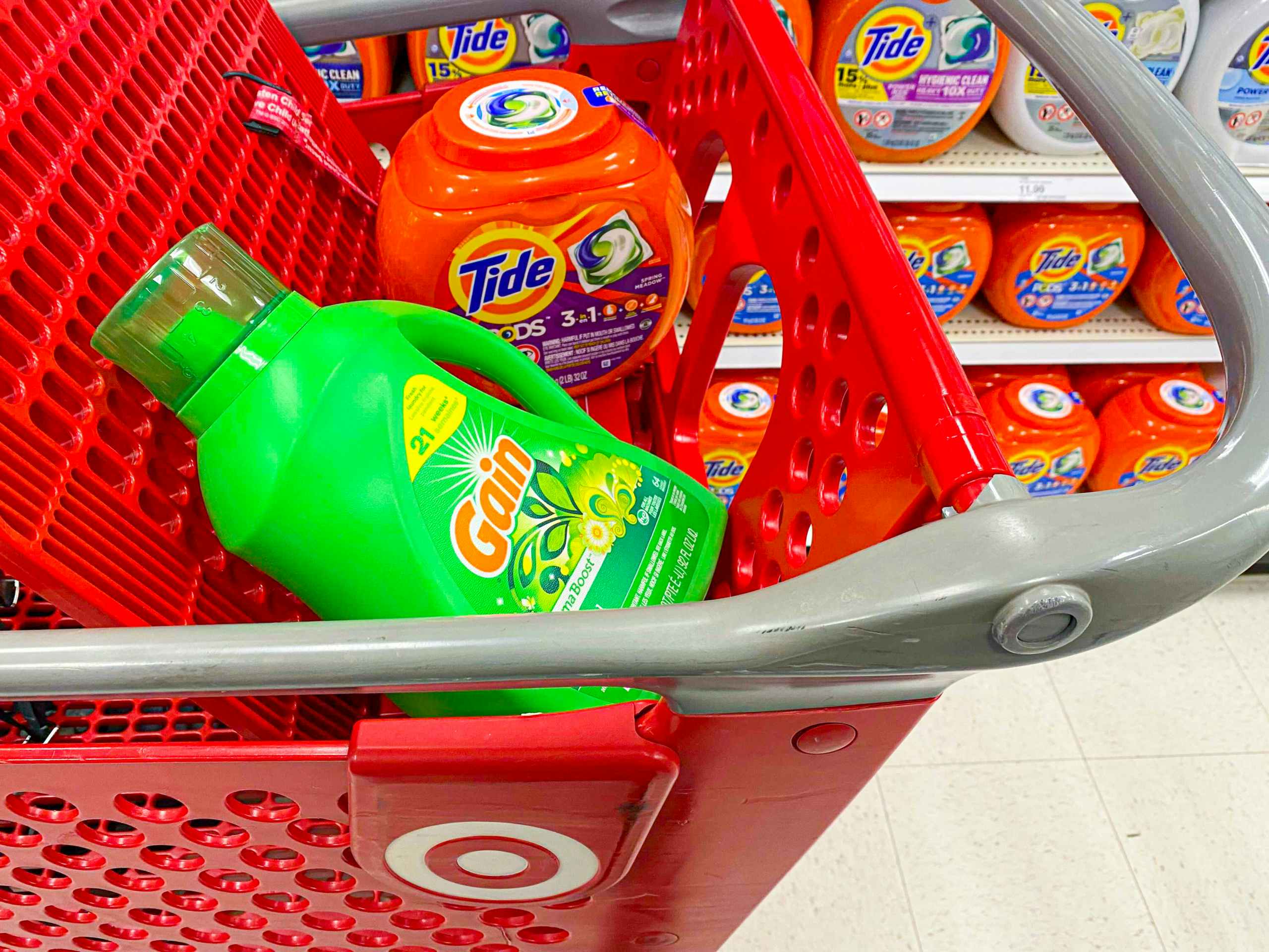 Gain and Tide laundry detergent in a store cart.