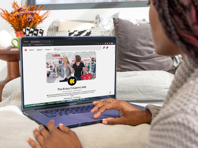 Someone using a laptop to browse the KCL Pinterest page