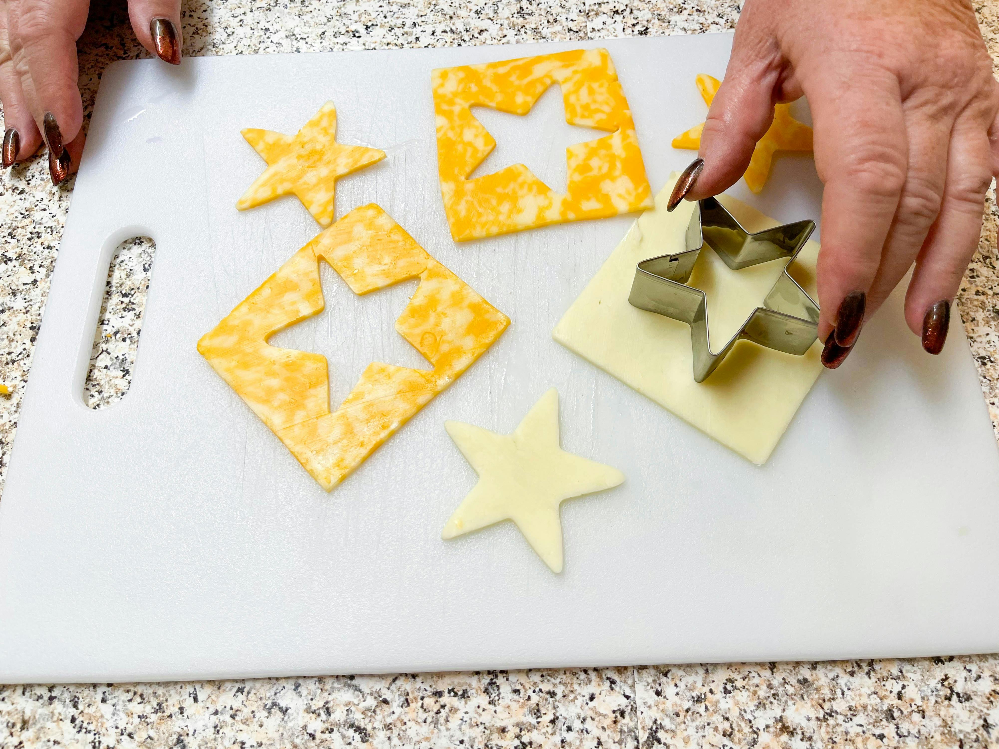 cutting cheese with cookie cutters 