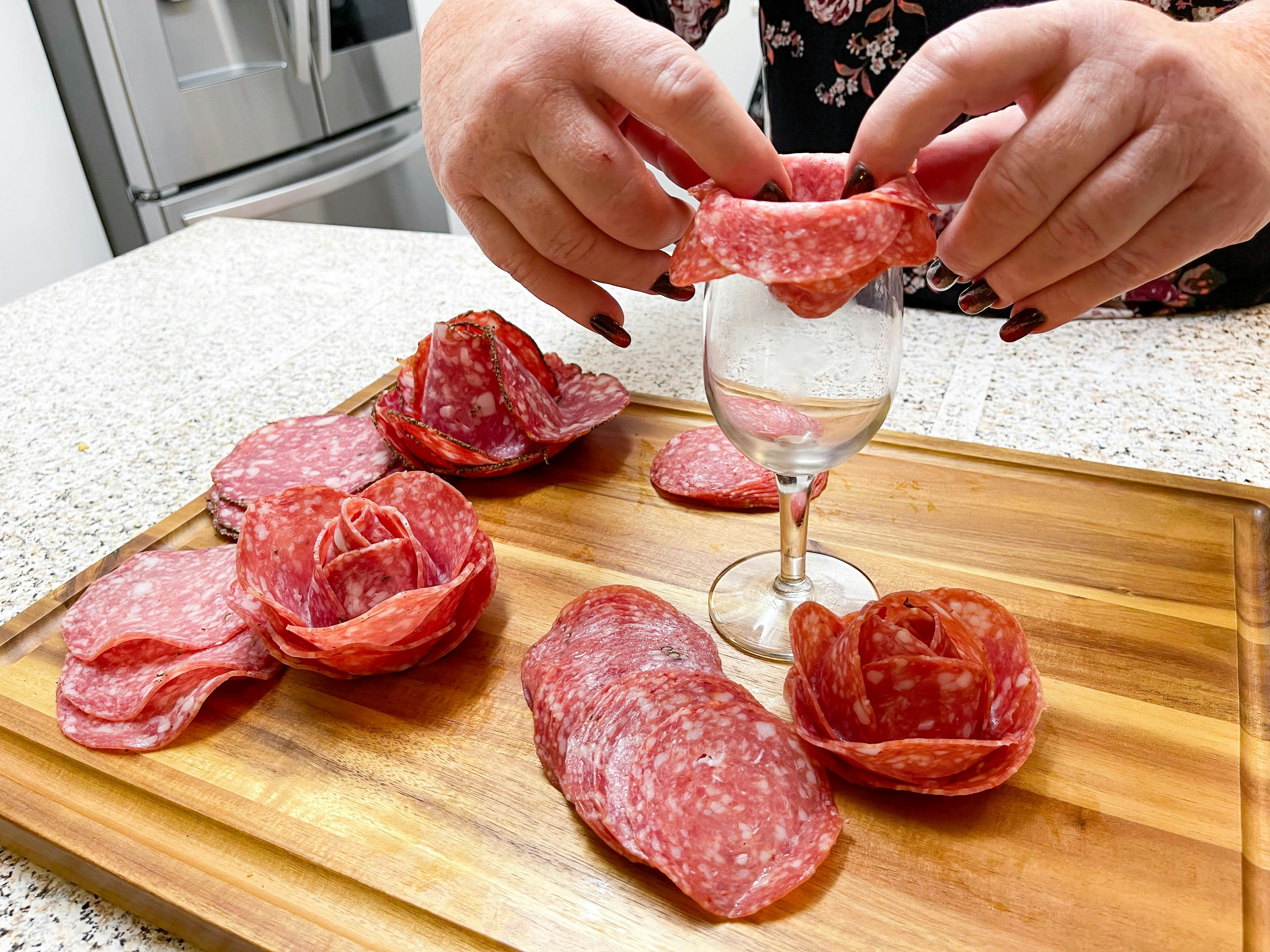 meat roses made from wine glasses 