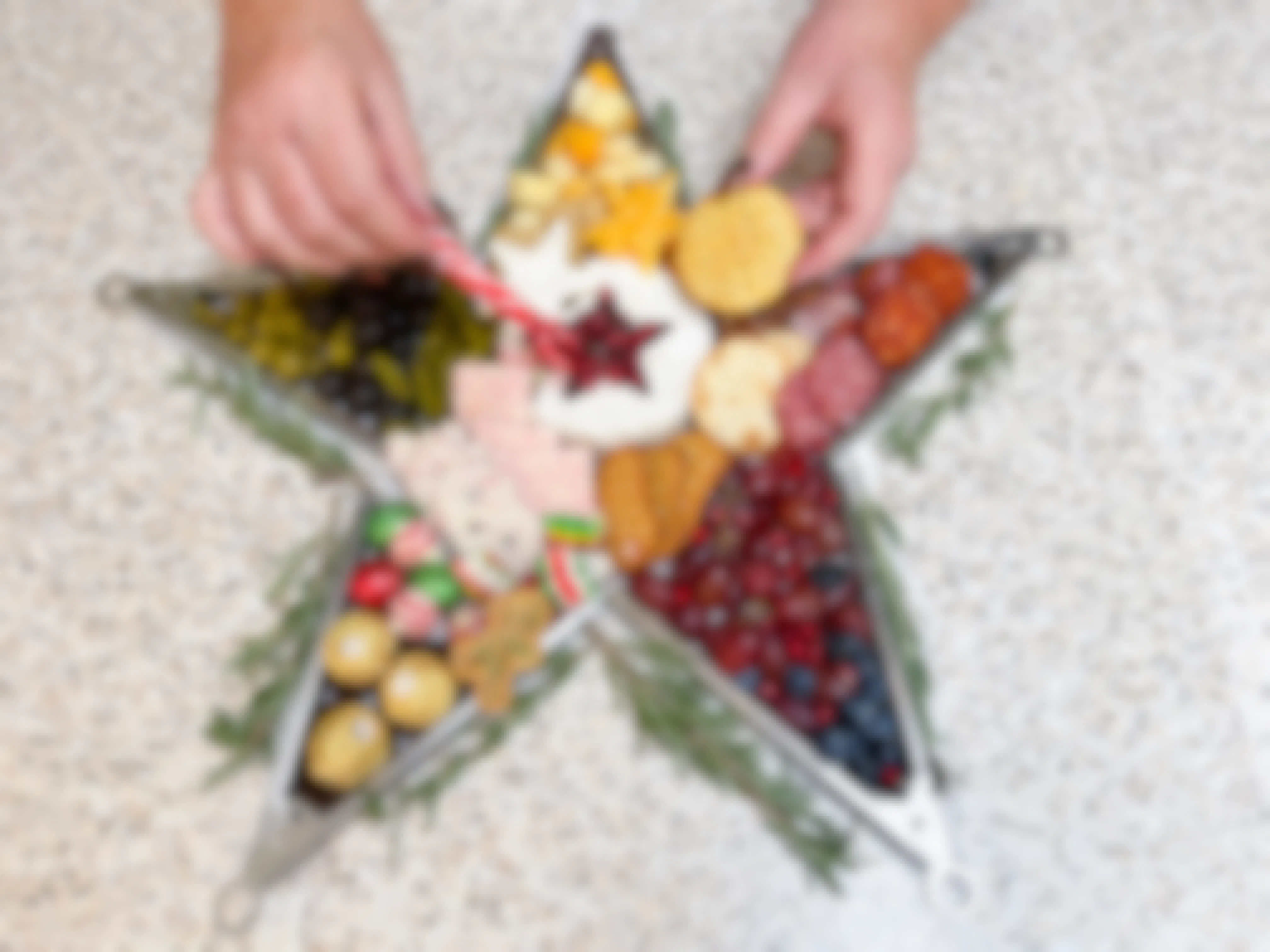 star shaped meat and cheese board made with tongs 