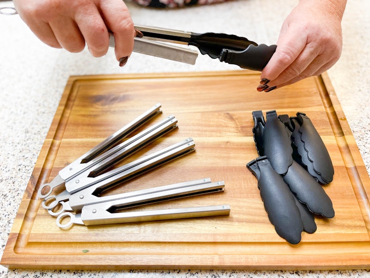 taking the plastic tops of metal kitchen tongs 