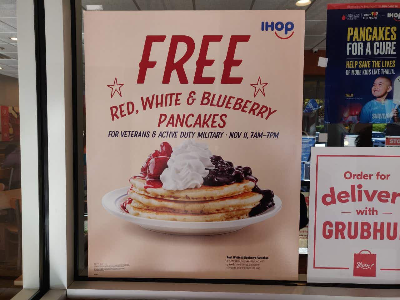 A veterans day advert for IHOP's red white and blueberry pancake