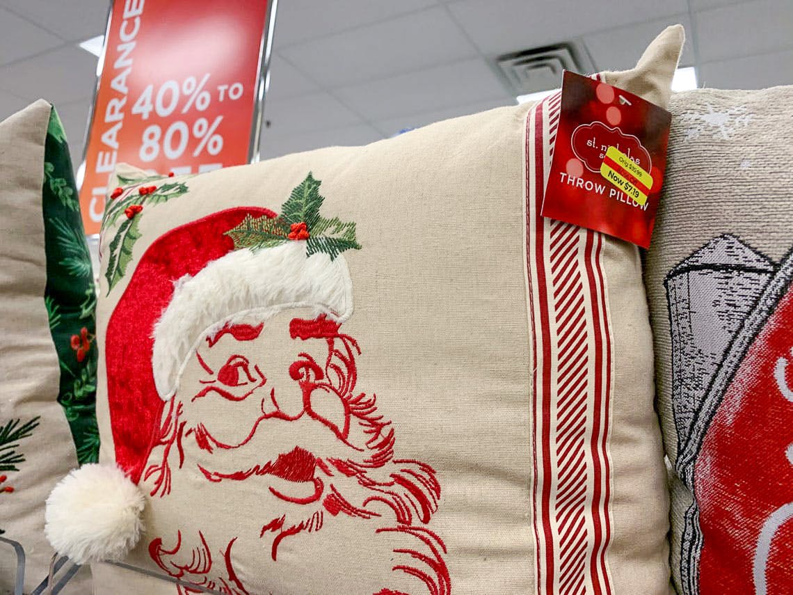 Santa embroidered throw pillow on shelf at Kohl's store