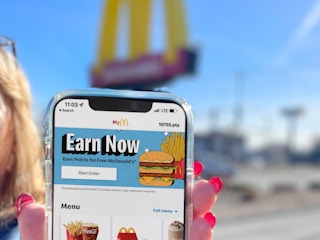 women holding cellphone with mcdonalds app