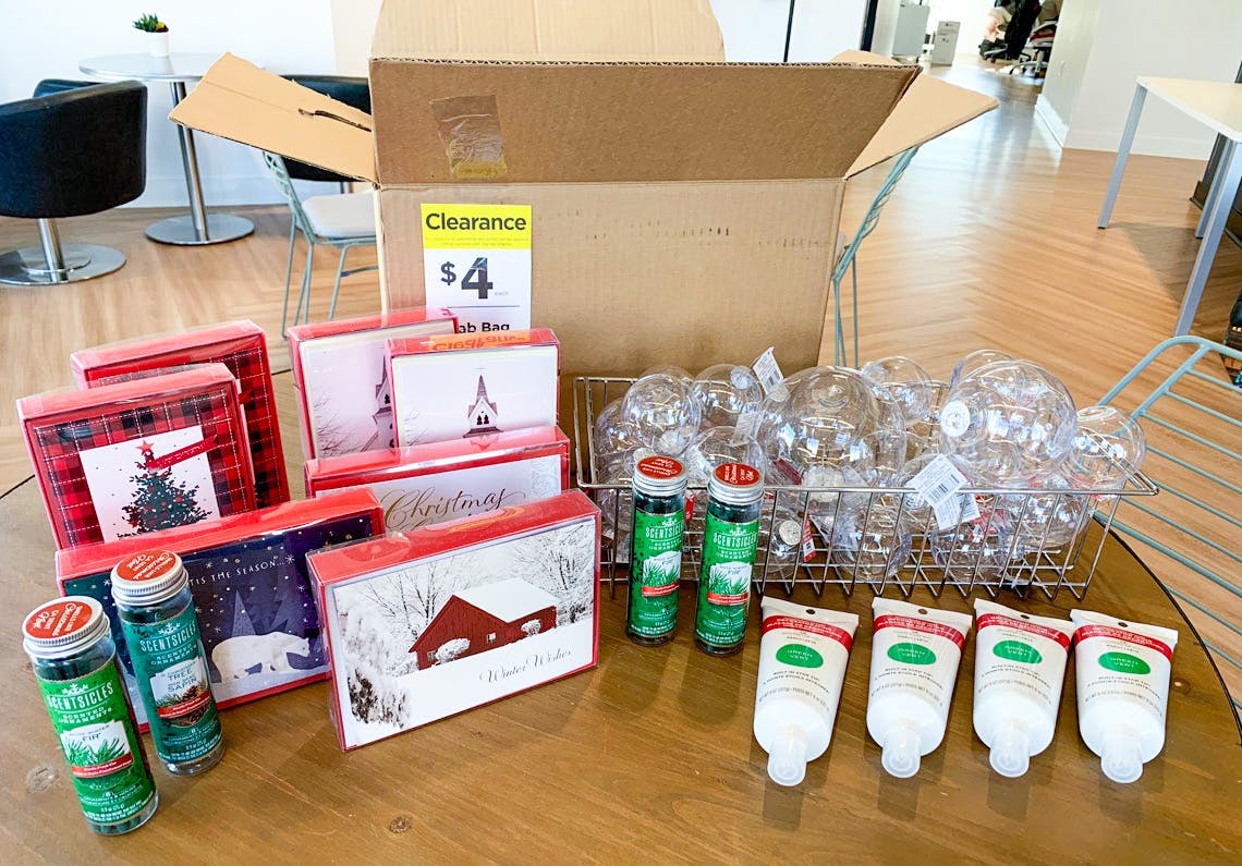 A Michaels grab bag box with holiday clearance contents on a table