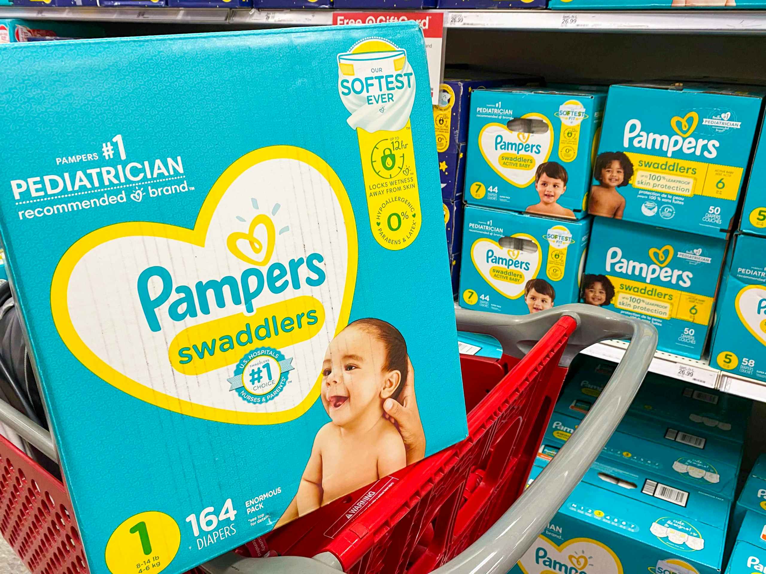 box of Pampers in Target shopping cart