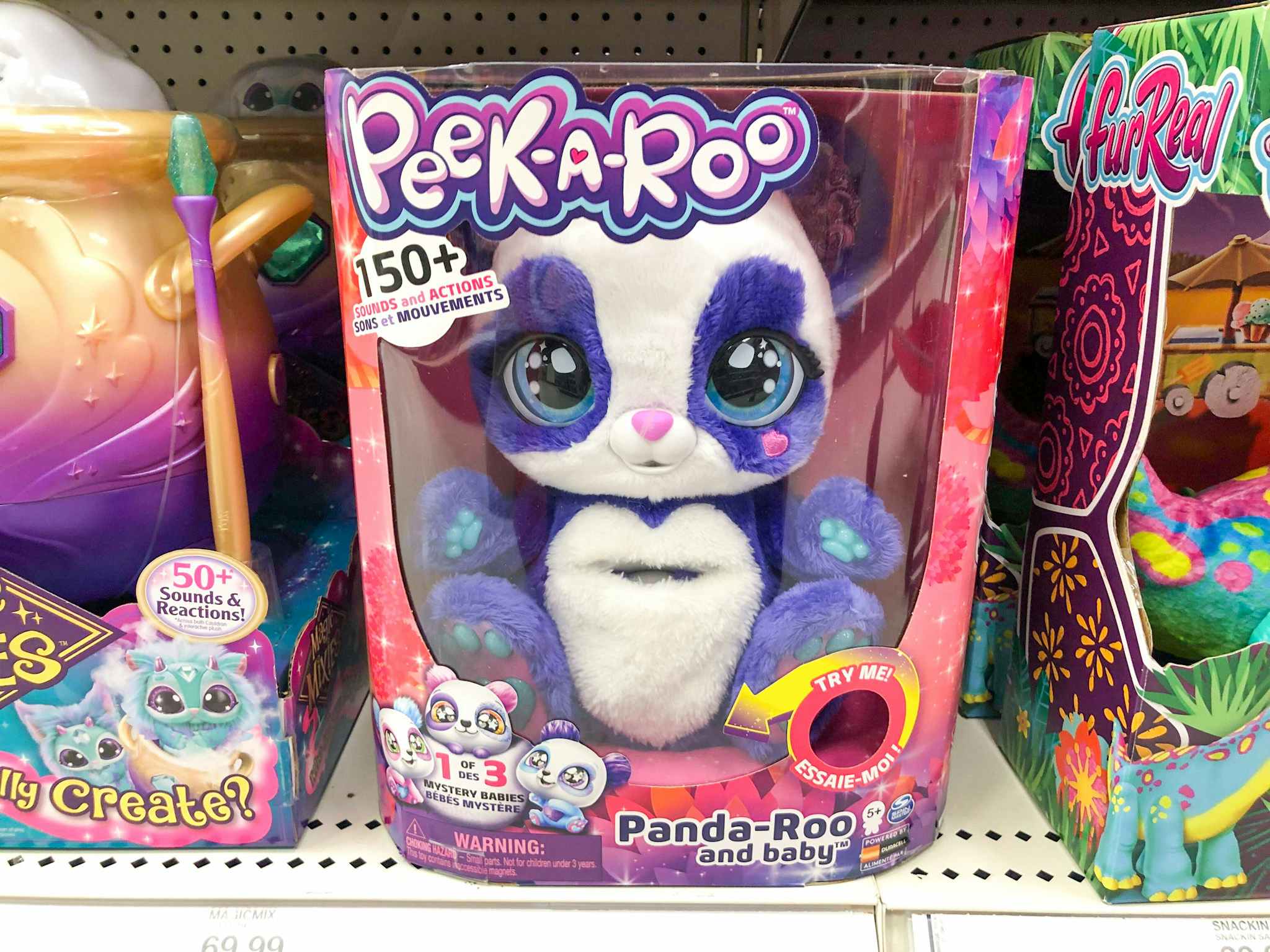 A Peek-A-Roo panda toy on a store shelf.