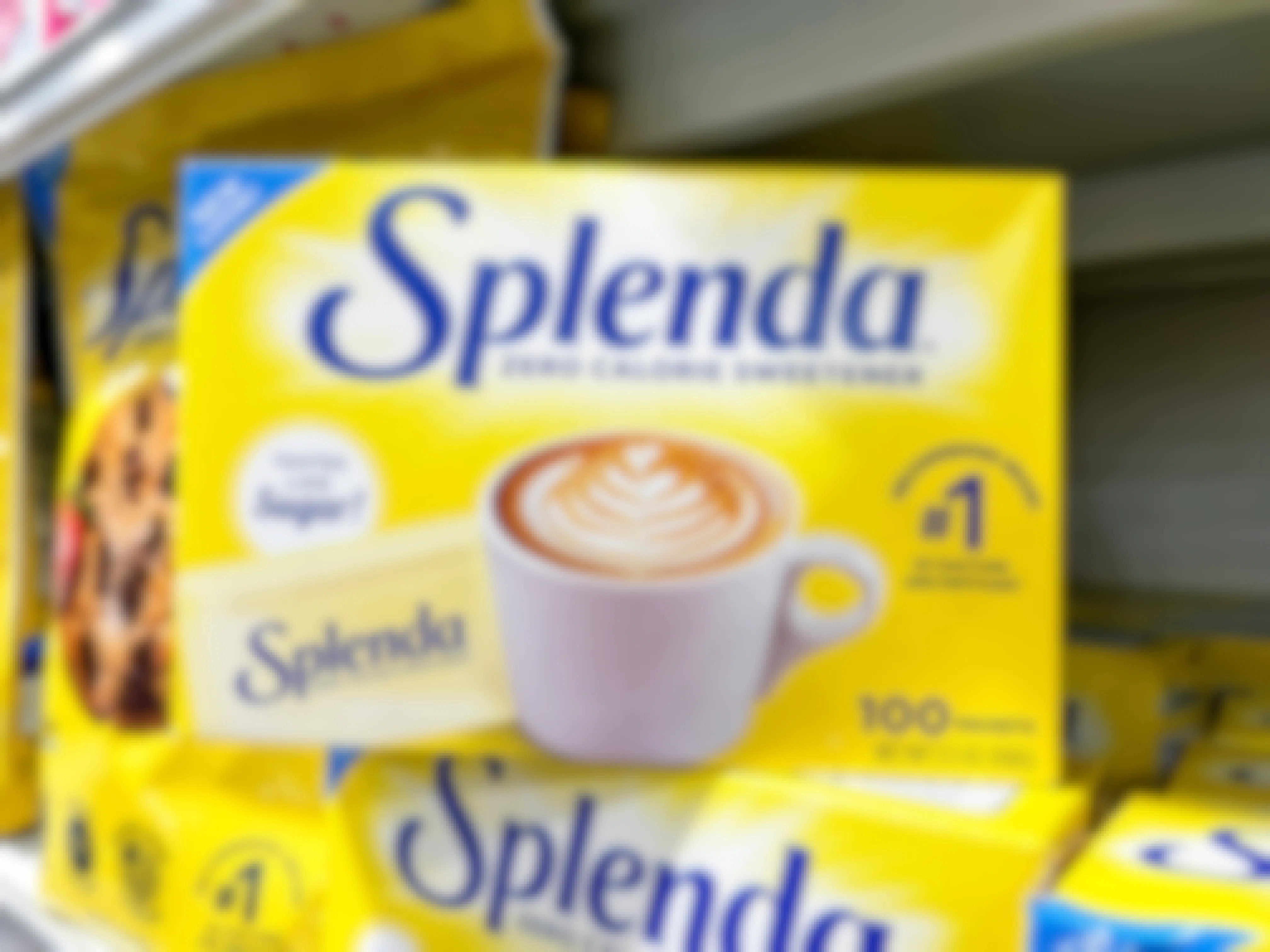 A box of 100 packets of Splenda sitting on another box of Splenda on the shelf at Publix.