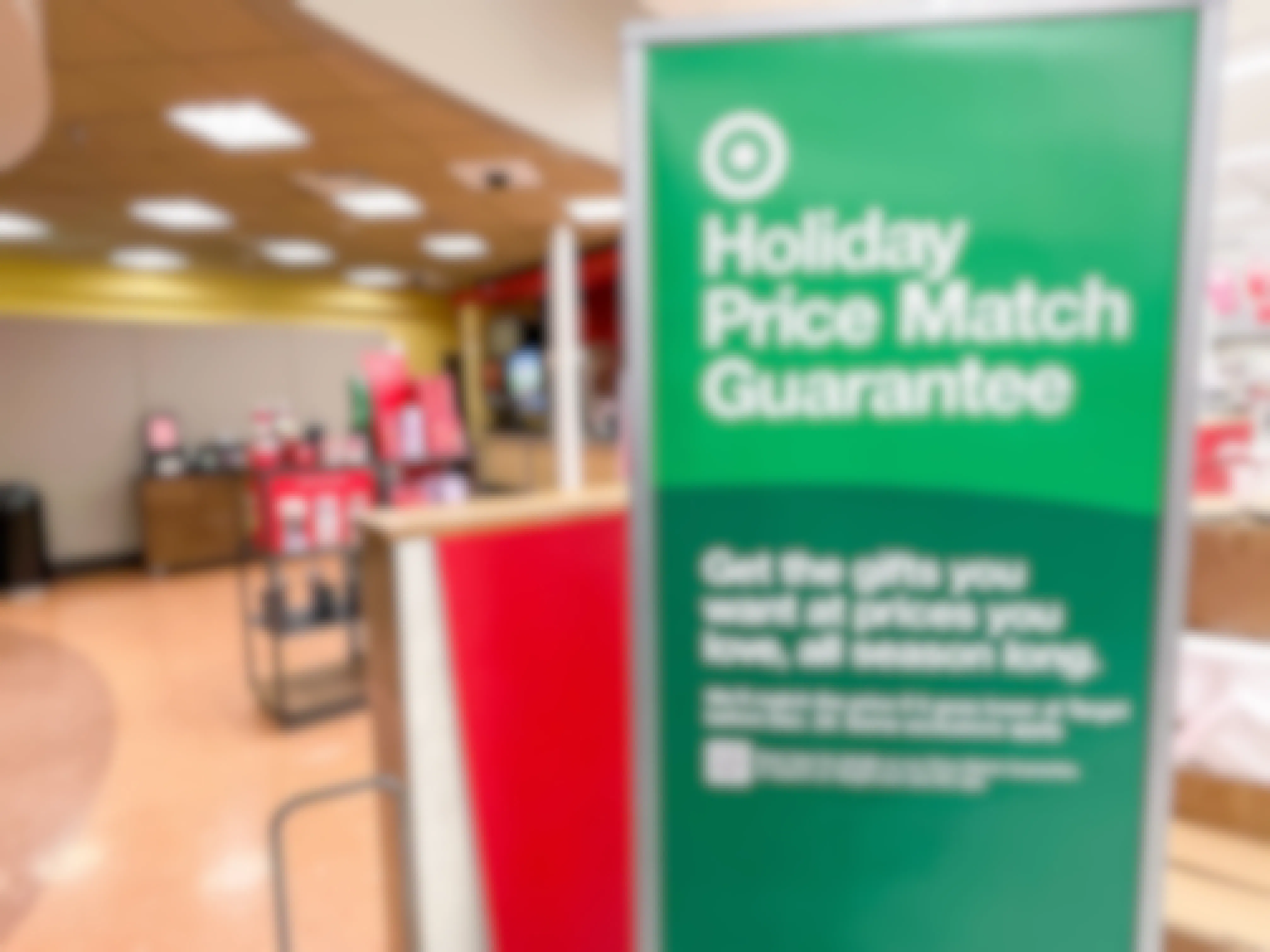 A holiday price match guarantee sign inside Target.
