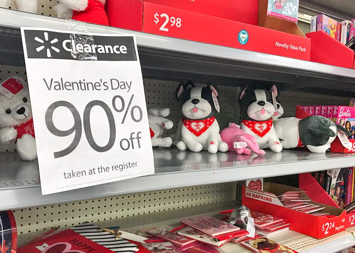 Valentine's day items on a shelf at the Walmart store with a 90% off sign