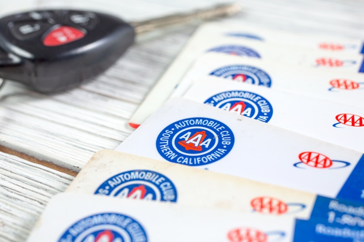 A pile of AAA membership cards