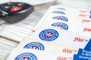 A pile of AAA membership cards