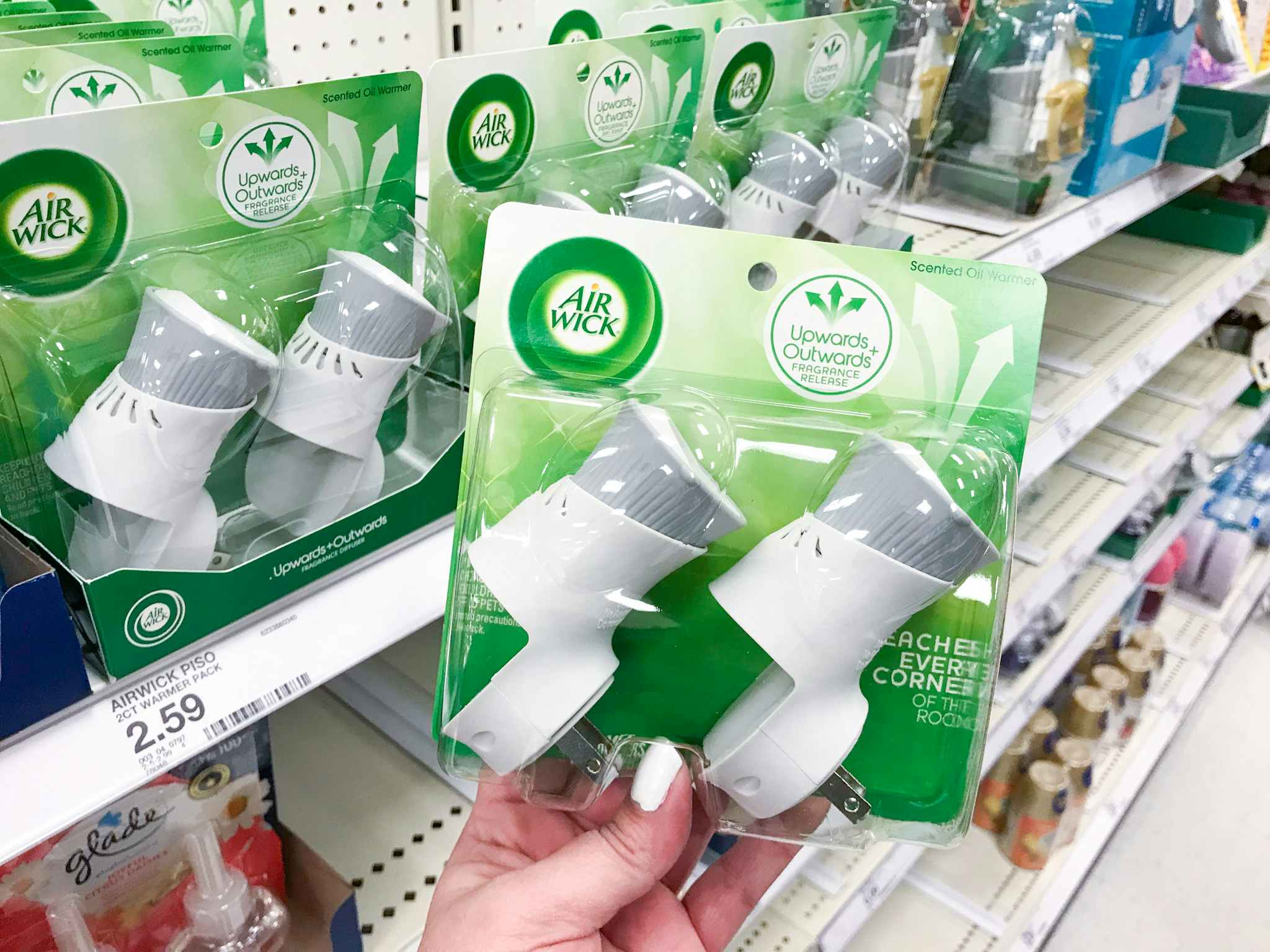 hand holding air wick scented oil warmers at target