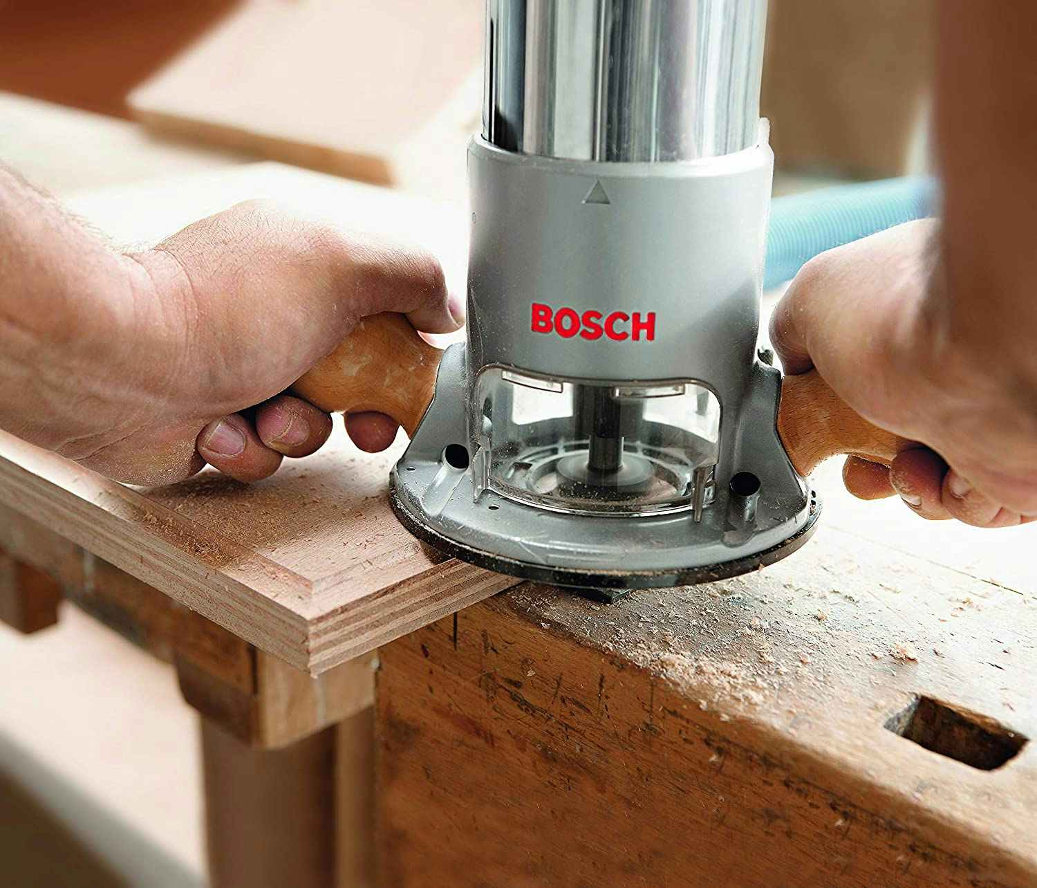A Bosch router being used on wood.