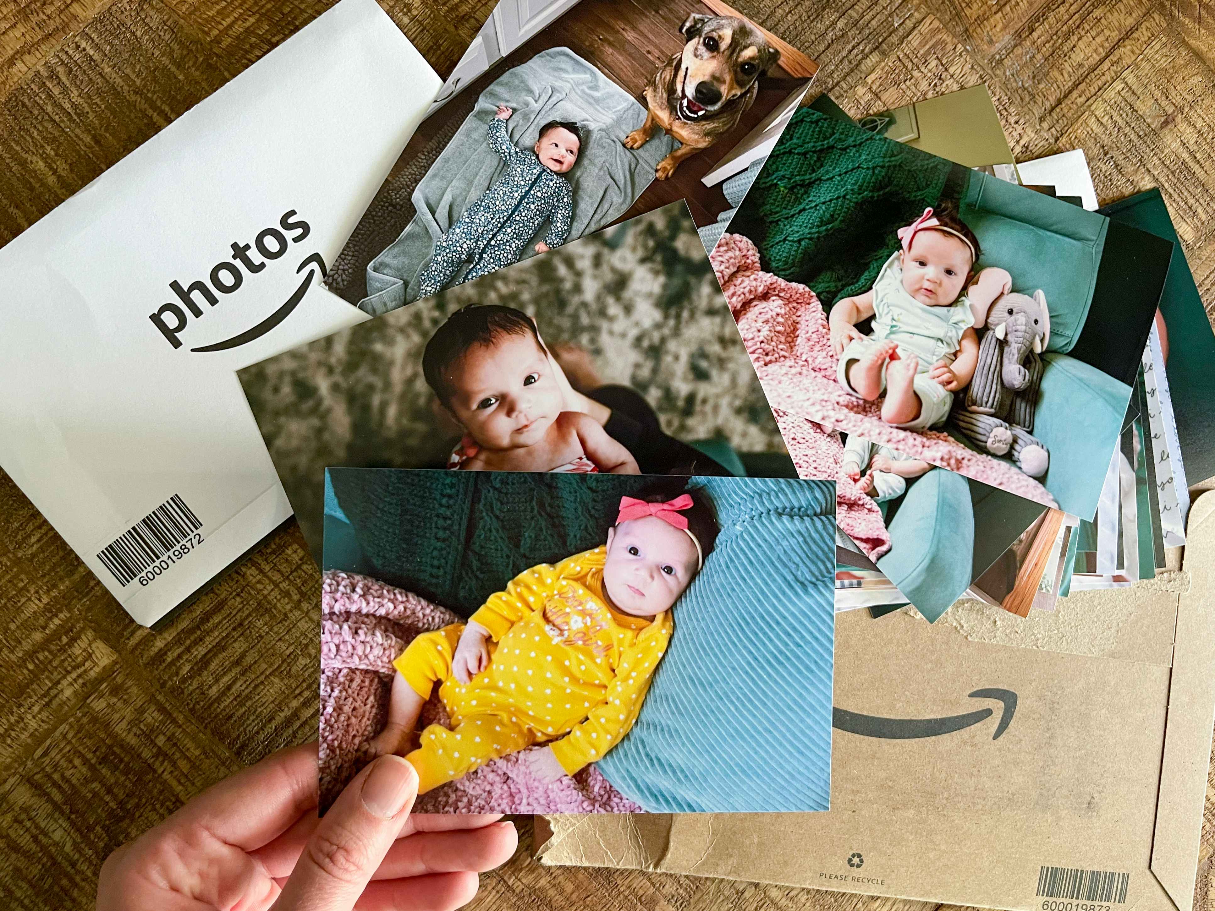 photo prints held next to amazon photo print packaging