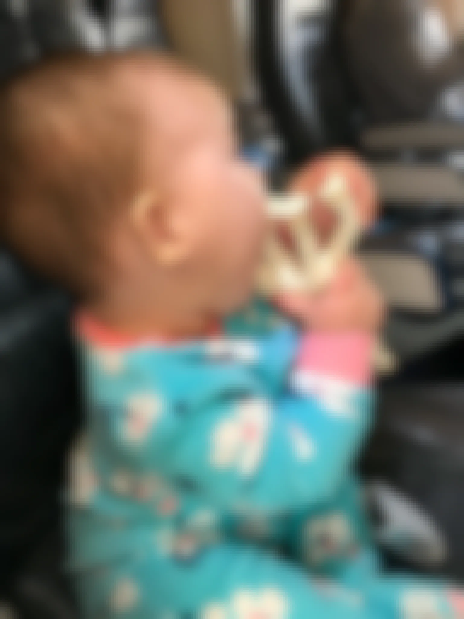 baby holding toy on plane