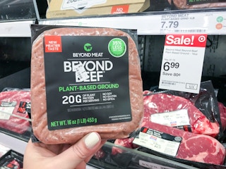 hand holding beyond beef ground in front of target sale tag