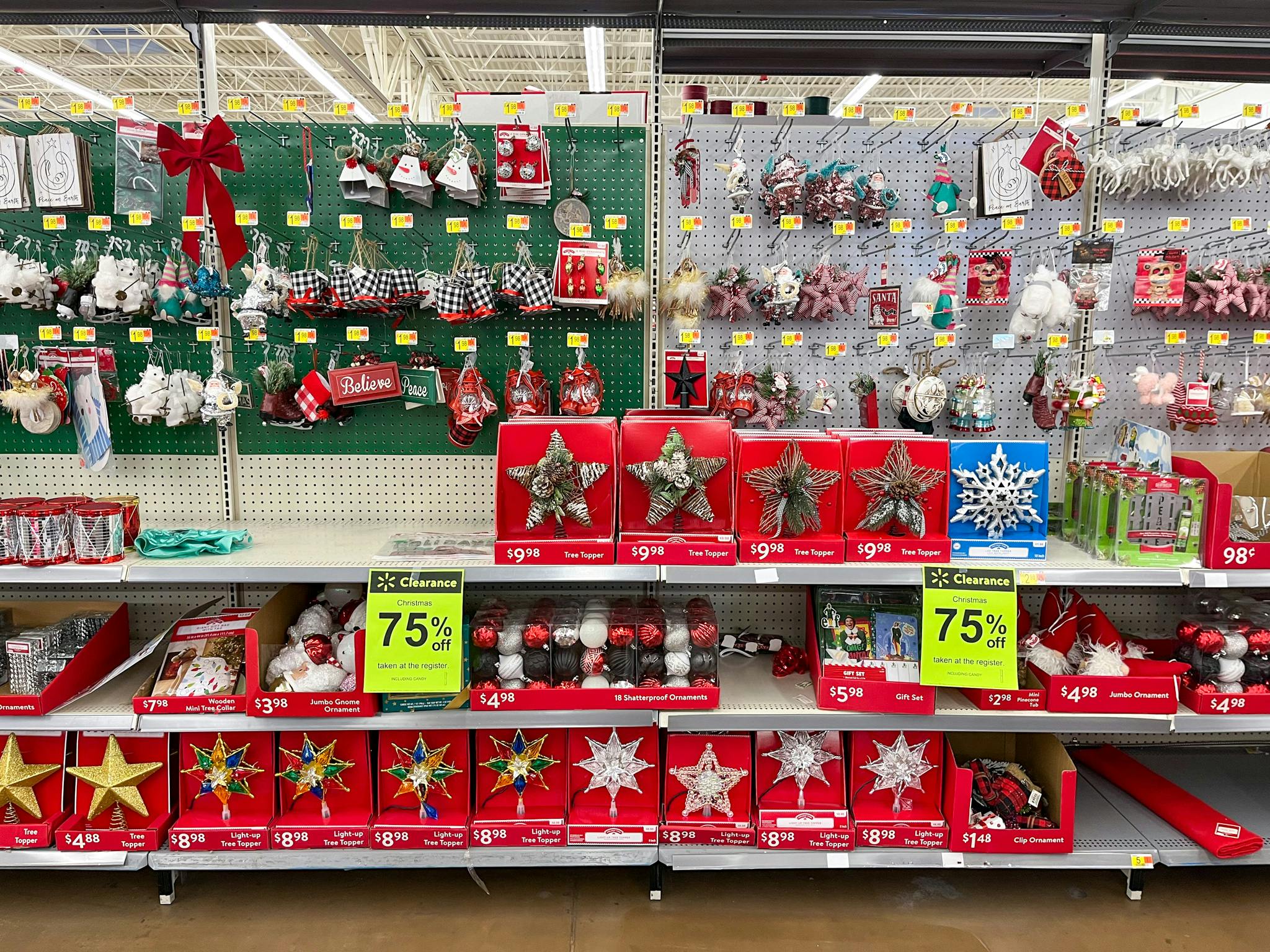 Shelves of Christmas clearance with 75% off sale signs at Walmart.