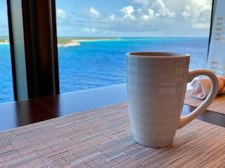 Cup of coffee in a cruise ship window