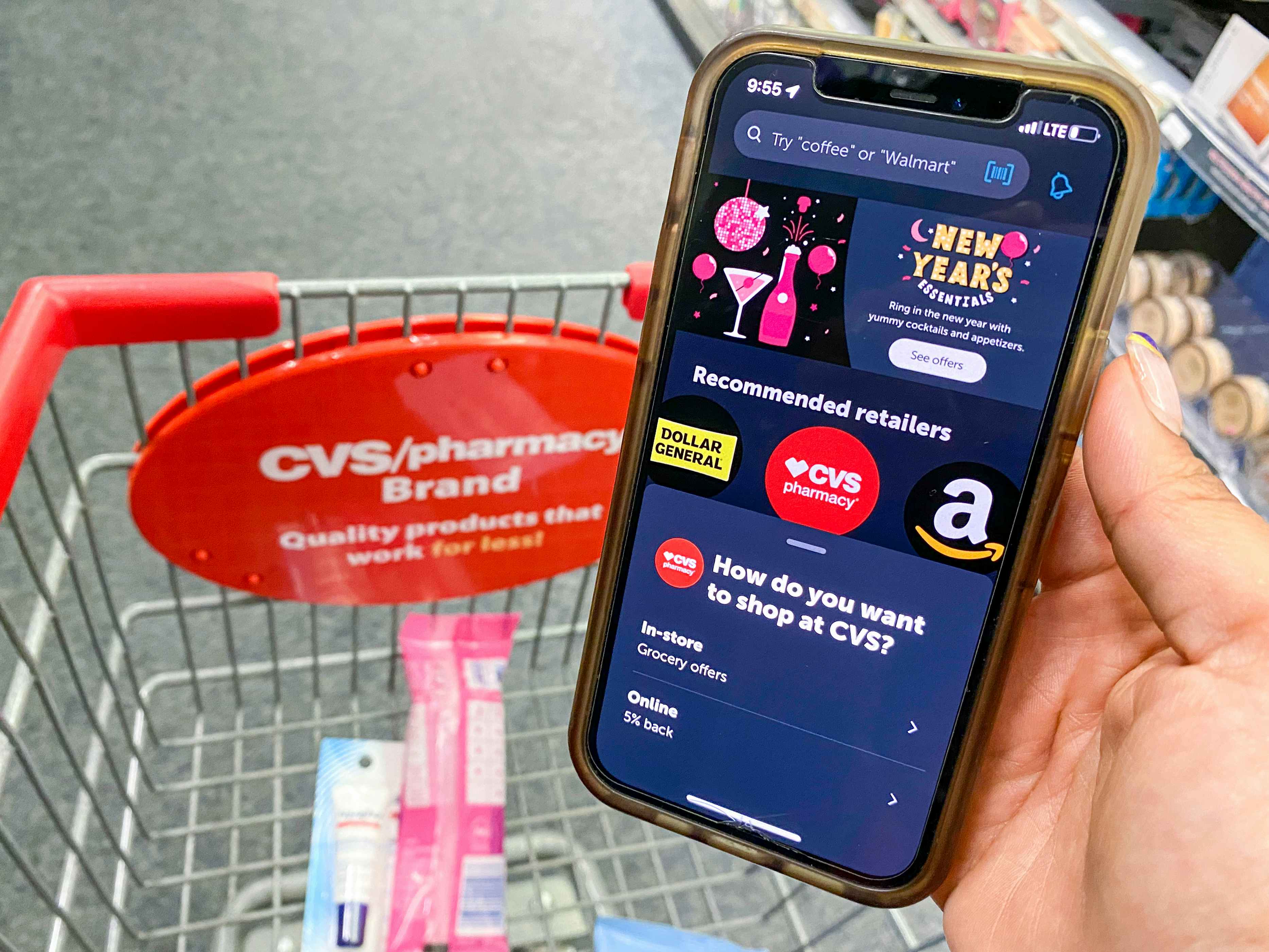 someone holding a phone with the Ibotta app. in cvs