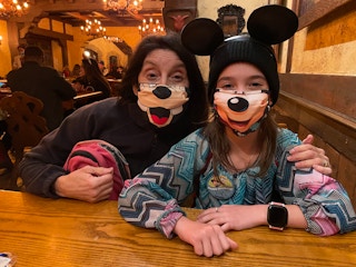 woman and kid at disneyland restaurant